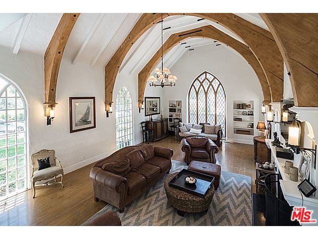 A large living room with a vaulted ceiling.