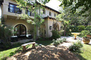 A home with a large yard and a patio.